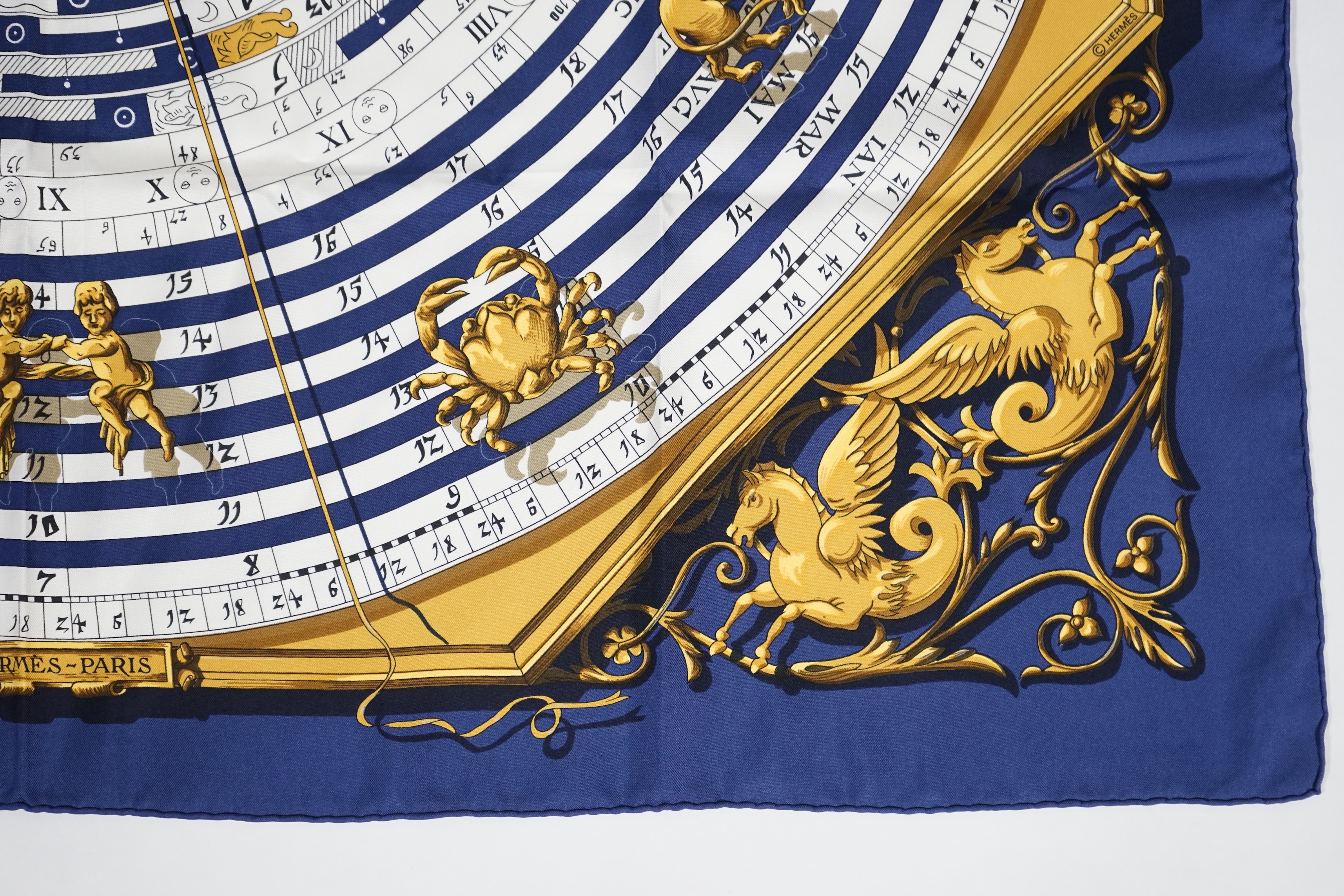 A Hermès Dies et Hore navy silk scarf, 90cm x 90cm